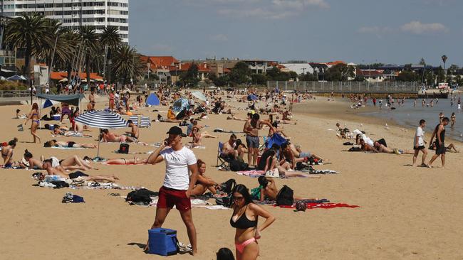 People enjoying the weather at St Kilda beach in Melbourne this year. Picture: NCA NewsWire / Daniel Pockett