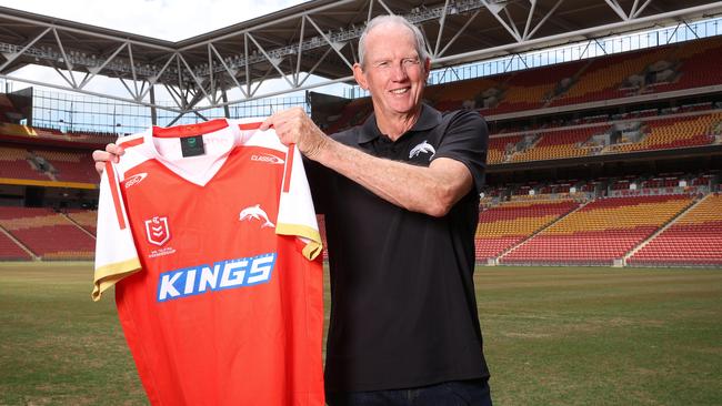 Coach Wayne Bennett holding the first Dolphins jersey. Picture: Liam Kidston.