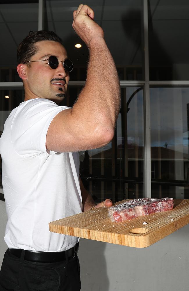 Luke Dahlhaus flexes his arms as the viral chef known as “Salt Bae”. Picture: Robert Cianflone/Getty Images