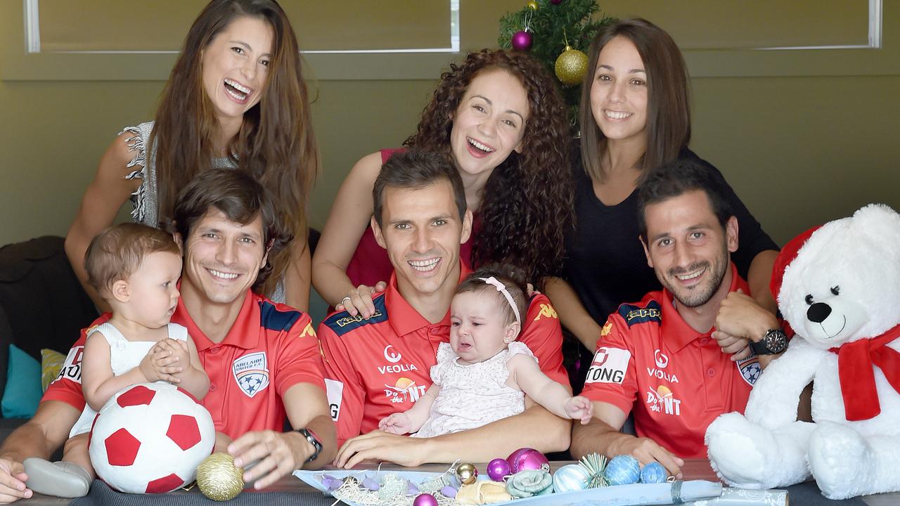 21/12/15 - Adelaide United Christmas _ Reds three spanish players (L-R) Pablo Sanchez with Maria Valdes and son Pablo Jnr, Isaias Sanchez with wife Sara Martinez and daughter Vega, 4 months and Sergio Cirio with partner Laura Nocea. Photo Naomi Jellicoe