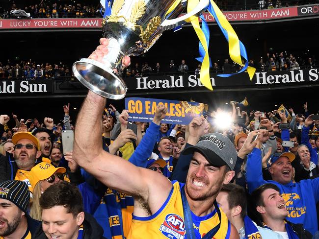 Lycett holds the premiership trophy after winning the 2018 AFL Grand Final between the West Coast Eagles and the Collingwood Magpies. Picture: Julian Smith