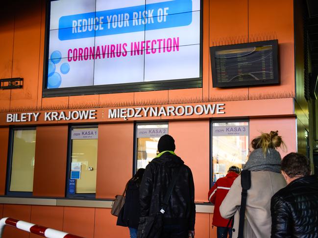 A warning sign with instructions to prevent risk of coronavirus contraction is seen at the bus station during the 2 weeks closure of universities, schools, museums and other public facilities in Cracow, Poland. Picture: Getty