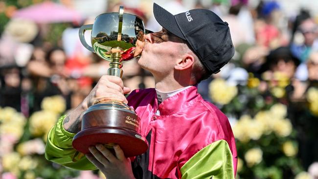 Robbie Dolan kisses the Melbourne Cup. Picture: Reg Ryan/Racing Photos via Getty Images