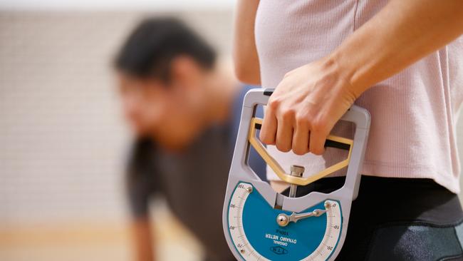 The 30kg grip test simulates holding a gun and pulling the trigger. Picture: Tim Pascoe