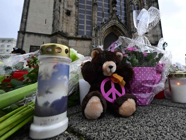 Tributes to the victims are seen outside the Johanniskirche (Johannes Church), a makeshift memorial near the site of a car-ramming attack on a Christmas market in Magdeburg. Picture: AFP