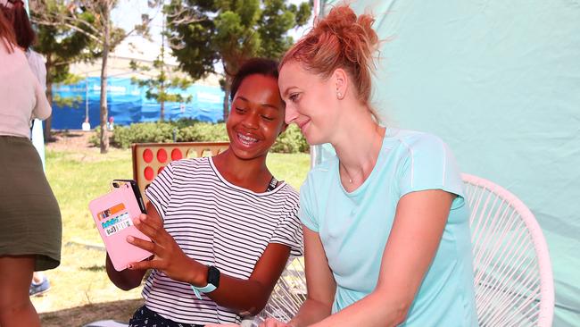 Petra Kvitova with a young fan. Picture: Jono Searle/Getty