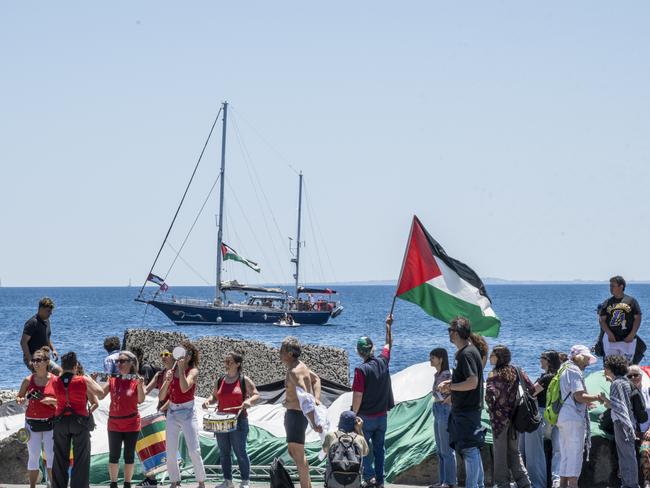 On the quay of San Giovanni Li Cuti, a group of activists attend the departure of the Madleen for Gaza with songs and Palestinian flags in Catania, Italy. Picture: Getty Images