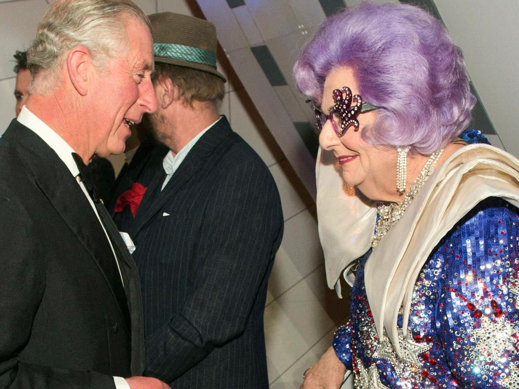 Barry Humphries speaks to the then Prince Charles, as he attends the Royal Variety Performance at the London Palladium Theatre in 2013. (Photo by ARTHUR EDWARDS / POOL / AFP)