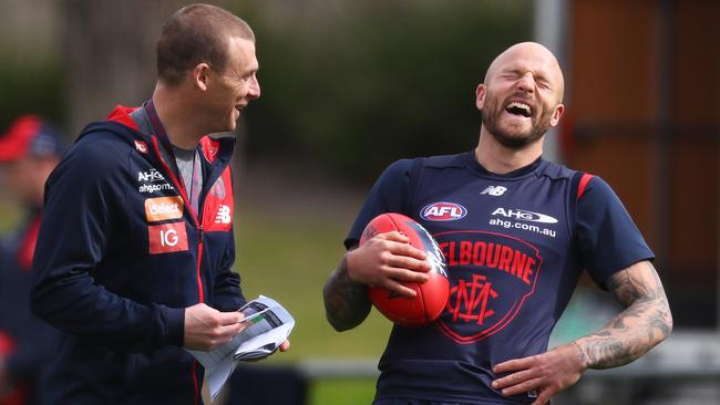 Melbourne coach Simon Goodwin has a laugh with captain Nathan Jones. Picture: Michael Klein