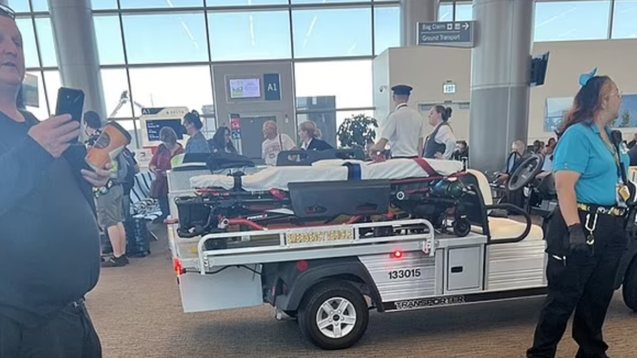 Paramedics outside of the Delta Air Lines gate. Picture: KLS