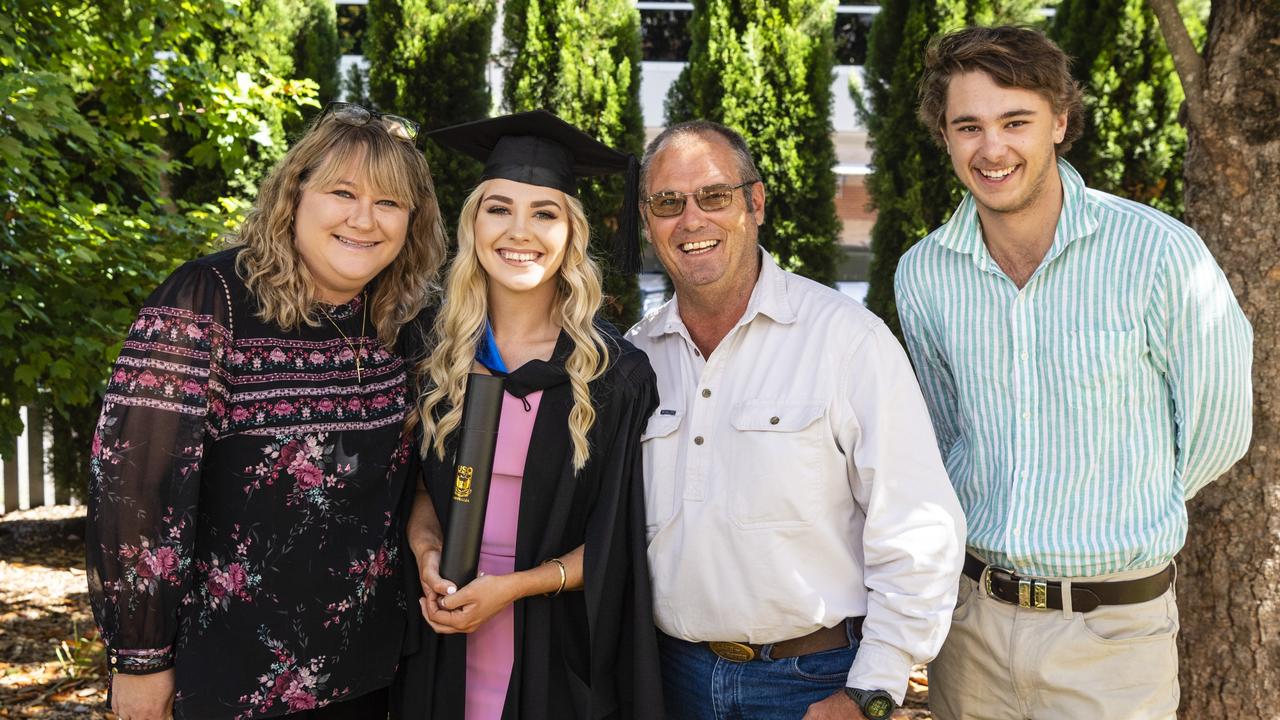 Bachelor of Sport and Exercise Science (First Class Honours) graduate Erin Wallace with mum Elaine Wallace, dad Travers Wallace and Thomas Pearce at the UniSQ graduation ceremony at Empire Theatres, Wednesday, December 14, 2022.