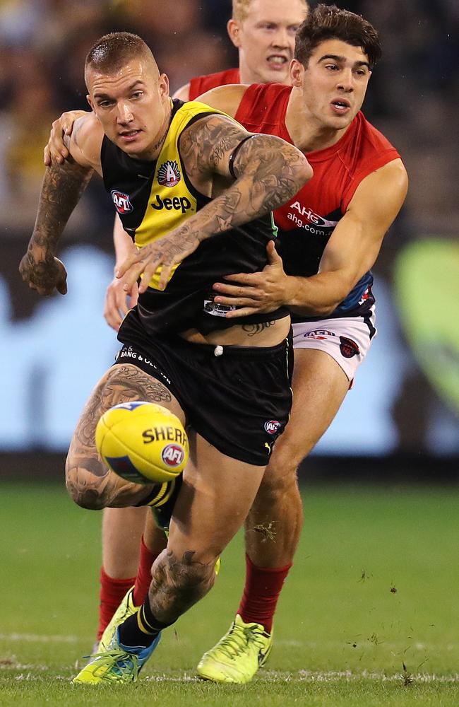 Who’s the better player? Richmond's Dustin Martin and Melbourne's Christian Petracca chase the loose footy. Picture: Michael Klein