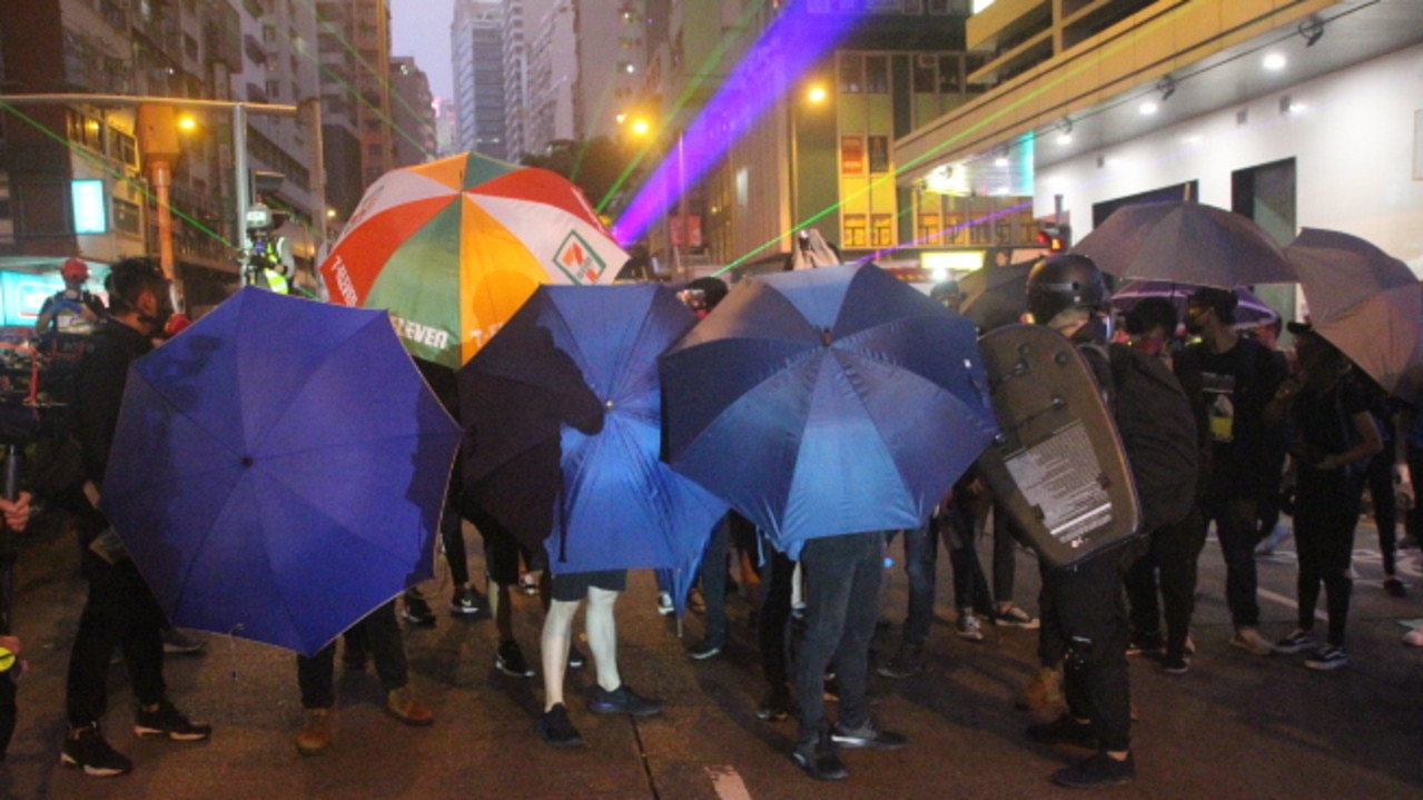 Protesters shield themselves in Hong Kong.