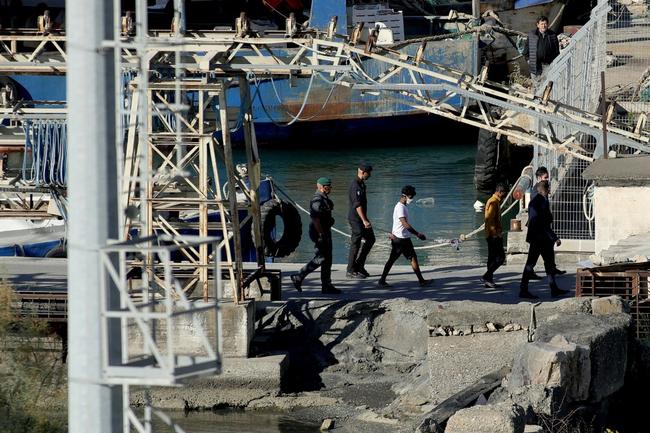 Migrants intercepted in Italian waters disembark at Shengjin port in Albania -- the first arrivals under a new deal between Rome and Tirana