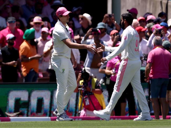 TOPSHOT - Australiaâs captain Pat Cummins (L) shakes hands with Indiaâs Jasprit Bumrah after Australia won the match on day three of the fifth cricket Test match between Australia and India at The SCG in Sydney on January 5, 2025. (Photo by DAVID GRAY / AFP) / -- IMAGE RESTRICTED TO EDITORIAL USE - STRICTLY NO COMMERCIAL USE --