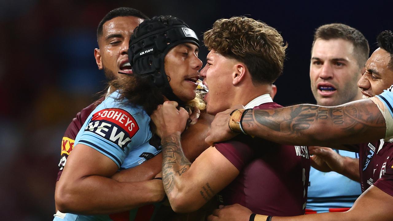 Jarome Luai of the Blues and Reece Walsh of the Maroons scuffle. (Photo by Chris Hyde/Getty Images)