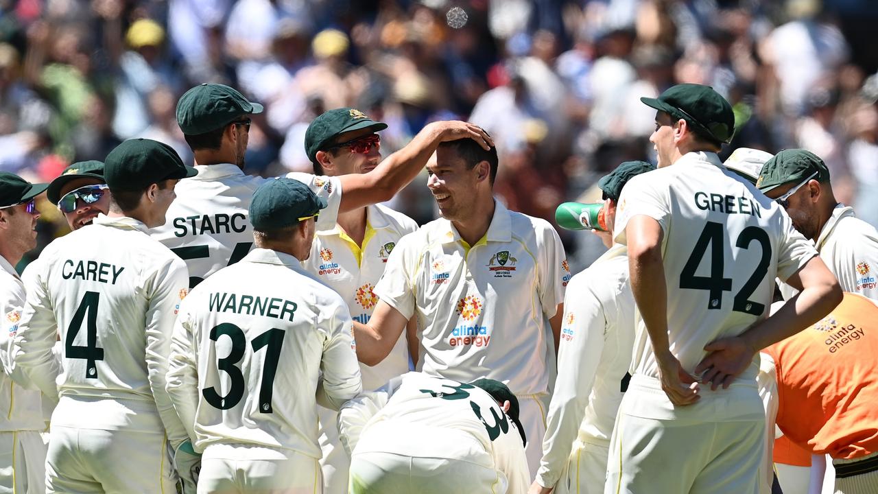 Scott Boland celebrates with teammates after dismissing Mark Wood. Picture: Getty