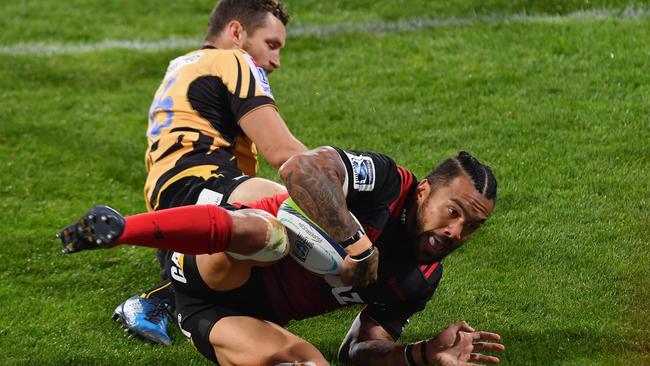 Digby Ioane of the Crusaders dives over to score a try.