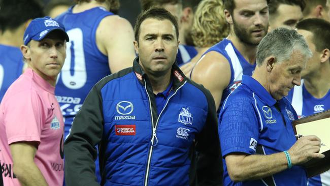 Brad Scott after talking to his players during quarter time against Fremantle.