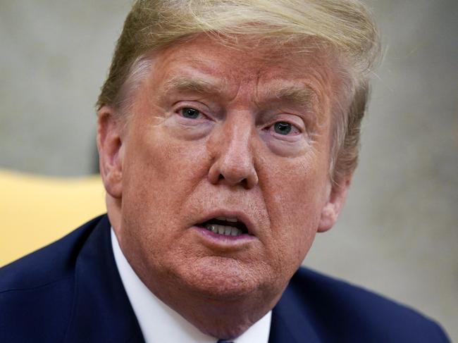 President Donald Trump speaks during a meeting with Gov. Kim Reynolds, R-Iowa, in the Oval Office of the White House, Wednesday, May 6, 2020, in Washington. (AP Photo/Evan Vucci)