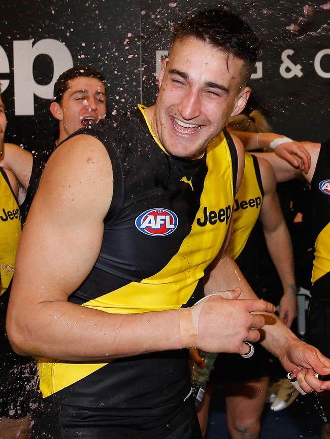 ...And his teammates helped him celebrate his first win at Richmond. Picture: Getty Images