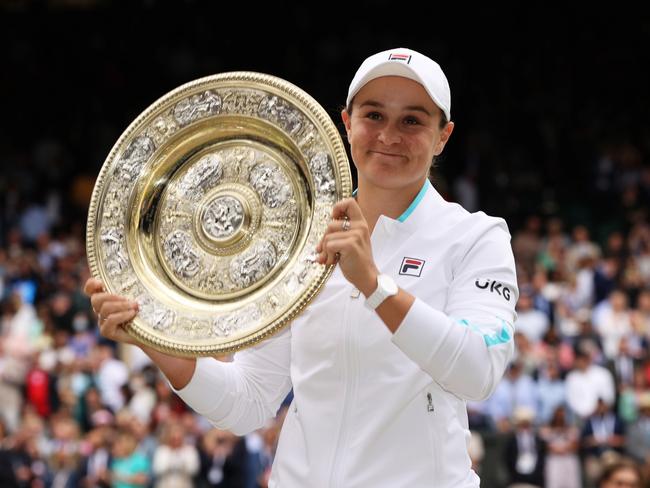 LONDON, ENGLAND - JULY 10: Ashleigh Barty of Australia celebrates with the Venus Rosewater Dish trophy after winning her Ladies' Singles Final match against Karolina Pliskova of The Czech Republic on Day Twelve of The Championships - Wimbledon 2021 at All England Lawn Tennis and Croquet Club on July 10, 2021 in London, England. (Photo by Clive Brunskill/Getty Images)