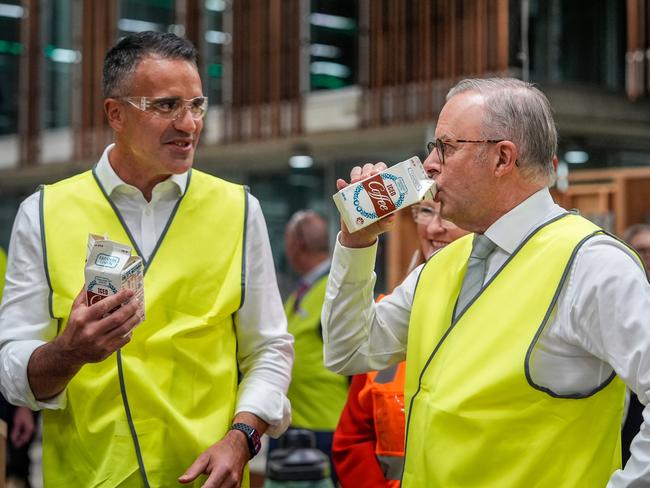 ADELAIDE, AUSTRALIA - MAY 01: Prime Minister Anthony Albanese drinks a carton of iced coffee flavoured milk with South Australia's Premier Peter Malinauskas, while visiting a TAFE in Tonsley, in the electorate of Boothby, on May 01, 2025 in Adelaide, Australia. Australia will hold a federal election on May 3. (Photo by Asanka Ratnayake/Getty Images)