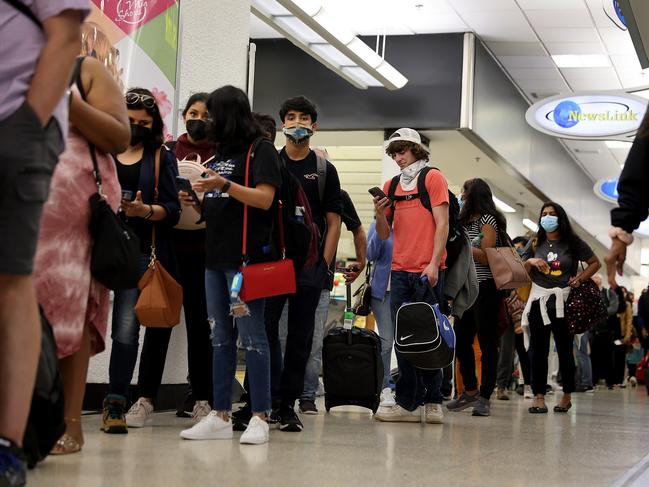 Travellers make their way through Miami International Airport. Picture: Getty Images