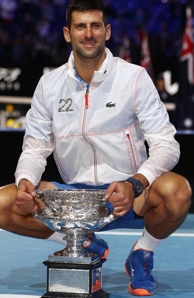 Djokovic poses with his trophy