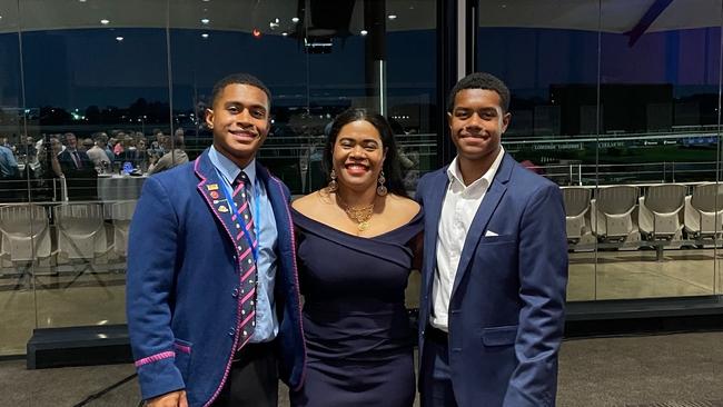 Young rugby player Dellacruz Paita and his family.