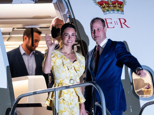 Catherine the Duchess of Cambridge and Britain's Prince William wave as they board a plane at Lynden Pindling International Airport in Nassau, The Bahamas, before heading home from their Caribbean tour. Picture: Chandan Khanna/AFP