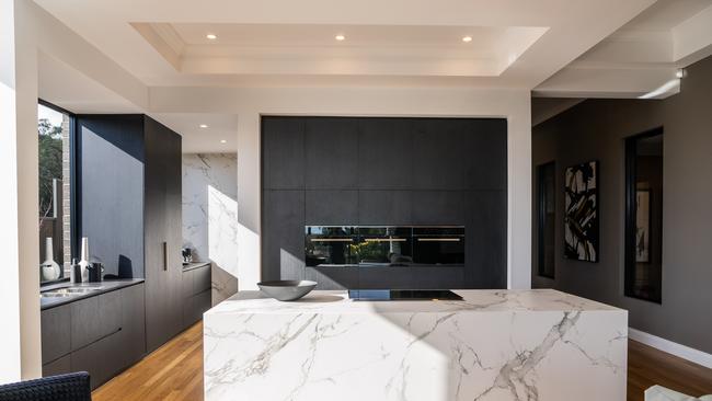 Hard edges and no nonsense – prepare to see a lot of this style of kitchen in our list. Because it’s stunning.