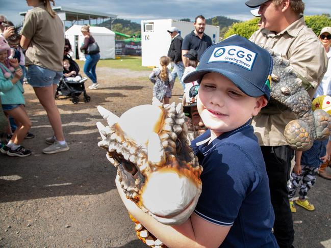 Spencer Johnstone gets to cuddle a dinosaur at the Heritage Bank Toowoomba Royal Show.Saturday April 20th, 2024 Picture: Bev Lacey