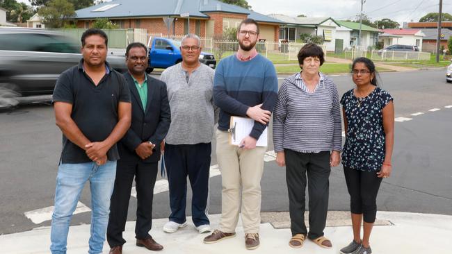 Pastor JJ Bomford (centre) rallied for safety upgrades to the deadly Crawford Rd intersection with residents in Raminder Sandhu, Livingston Chettipally, Skate Naufahu, Iva Maras and Premi Arun in April. Picture: Angelo Velardo