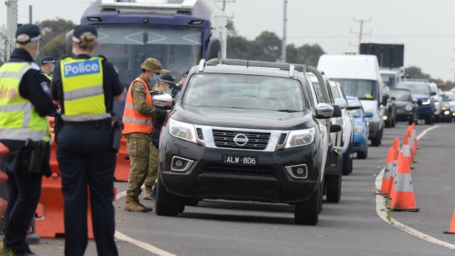 Traffic is banked back at a checkpoint on the Princes Freeway heading out of Melbourne towards Geelong at Little River. Picture: Andrew Henshaw