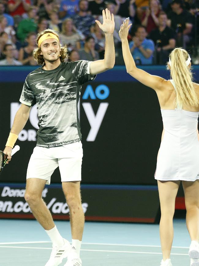 Stefanos Tsitsipas high fives Caroline Wozniacki. Picture: Getty Images