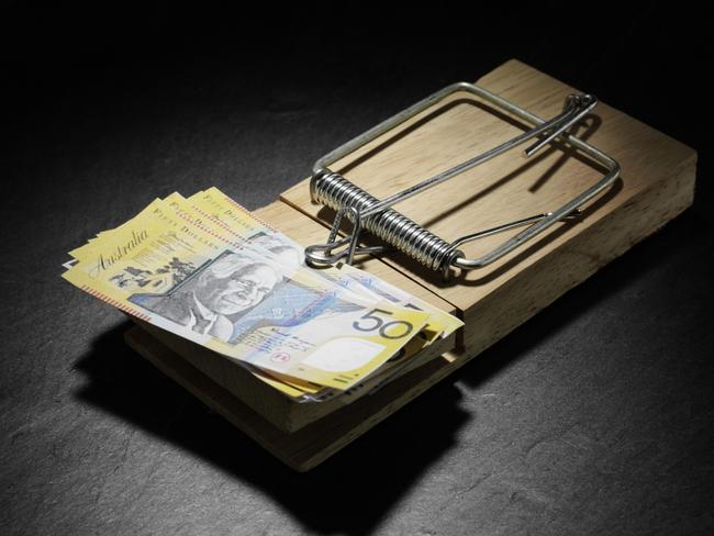 Australian dollars in a mousetrap. money, generic $50 notes