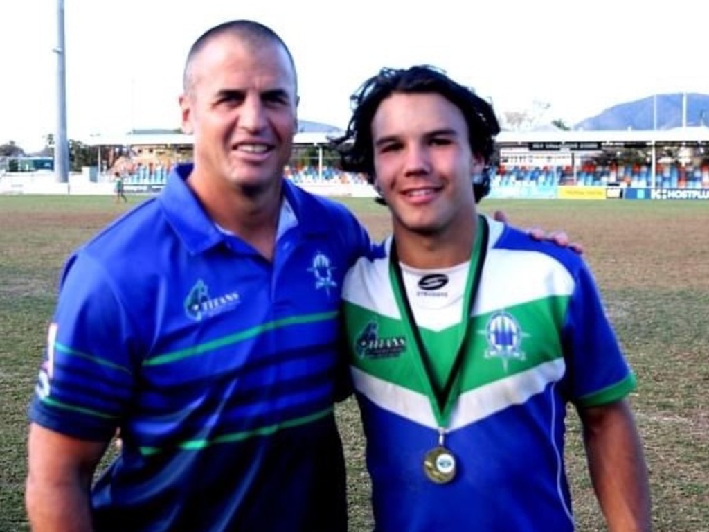 The Cathedral College Open A coach Tony Martin with his son Tana after the team's win over St Brendan's College in the Rockhampton District Secondary Schools Rugby League grand final.