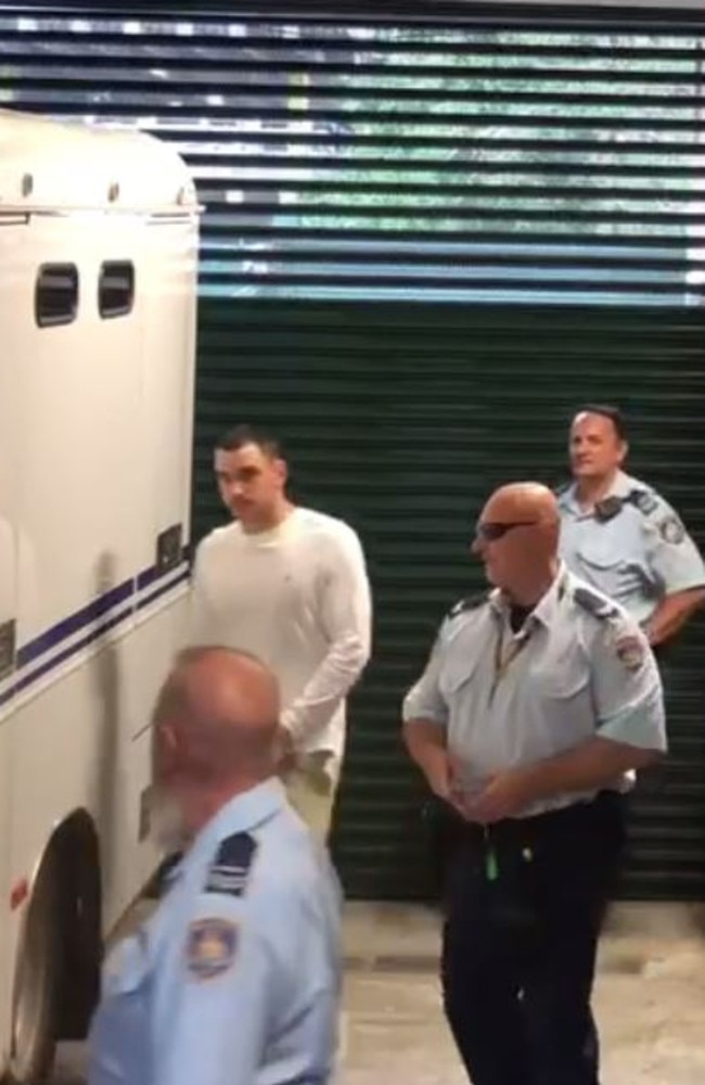 Matthew Flame is led out of Manly Court after he was charged over killing his one-time best friend, Liam Anderson, the son of Rose Tattoo’s Angry Anderson. Picture: Olivia Caisley/The Australian