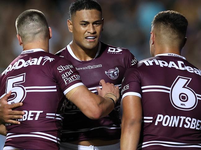 SYDNEY, AUSTRALIA - MARCH 16:  Haumole Olakau'atu of the Sea Eagles celebrates with team mates after scoring a try during the round three NRL match between Manly Sea Eagles and Parramatta Eels at 4 Pines Park on March 16, 2023 in Sydney, Australia. (Photo by Cameron Spencer/Getty Images)