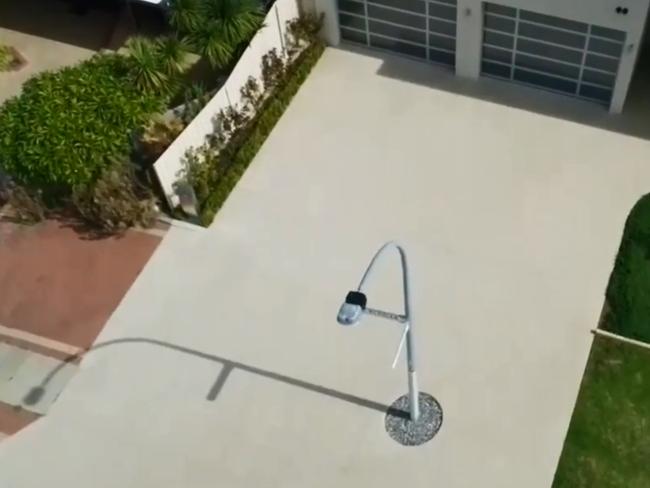 A Perth couple is locked in a battle with its local council and Western Power over a lamp post right that’s been placed in the middle of their driveway. Picture: Nine News.