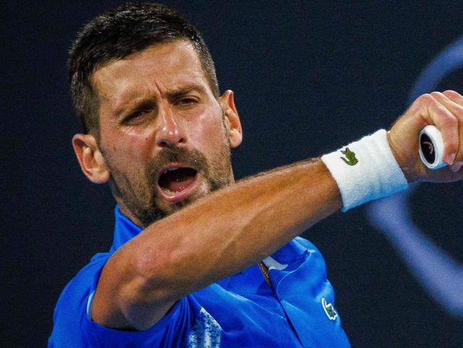 Serbiaâs Novak Djokovic hits a return during the menâs singles match against Australiaâs Rinky Hijikata at the Brisbane International tennis tournament in Brisbane on December 31, 2024. (Photo by Patrick HAMILTON / AFP) / -- IMAGE RESTRICTED TO EDITORIAL USE - STRICTLY NO COMMERCIAL USE --