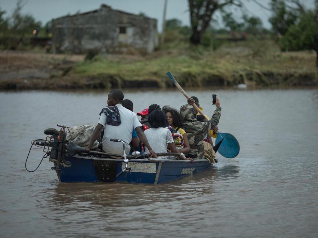 Locals have been using boats to rescue people stuck in trees for days. 