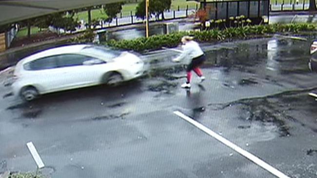 Footage of the terrifying moment a man drives away in an allegedly stolen car at Klemzig, with a baby in the backseat – the mother raced out to try and stop the car. Picture: Seven News