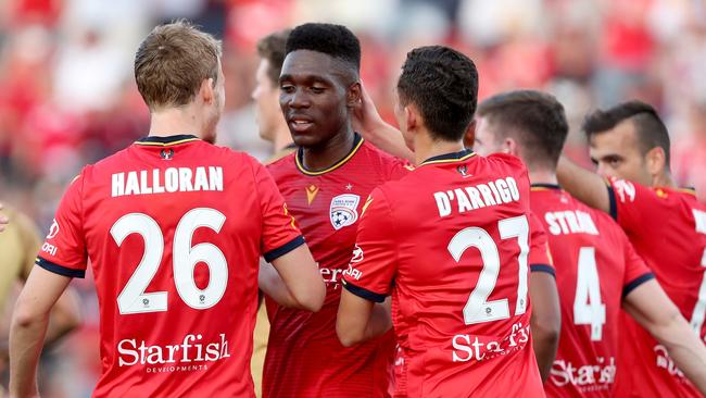 Teenage striker Al Hassan Toure celebrates his early equaliser for Adelaide United. Picture: AAP Image/James Elsby