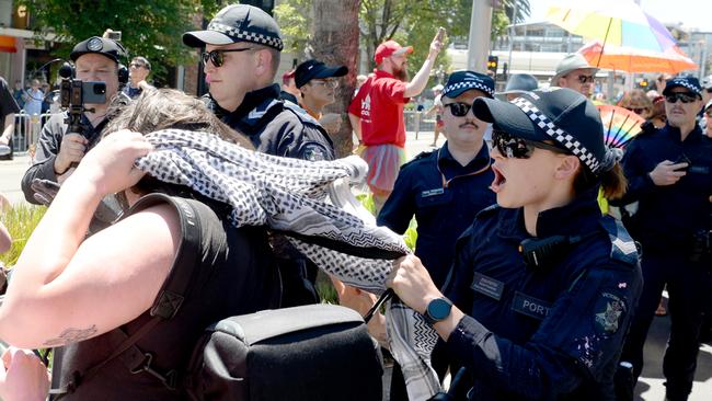 A small group of protesters clashes with police at the Midsumma Pride March. Picture: Andrew Henshaw
