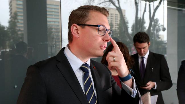 Up goes the finger — as Transport Minister Stephan Knoll is caught out. Picture: Kelly Barnes/AAP