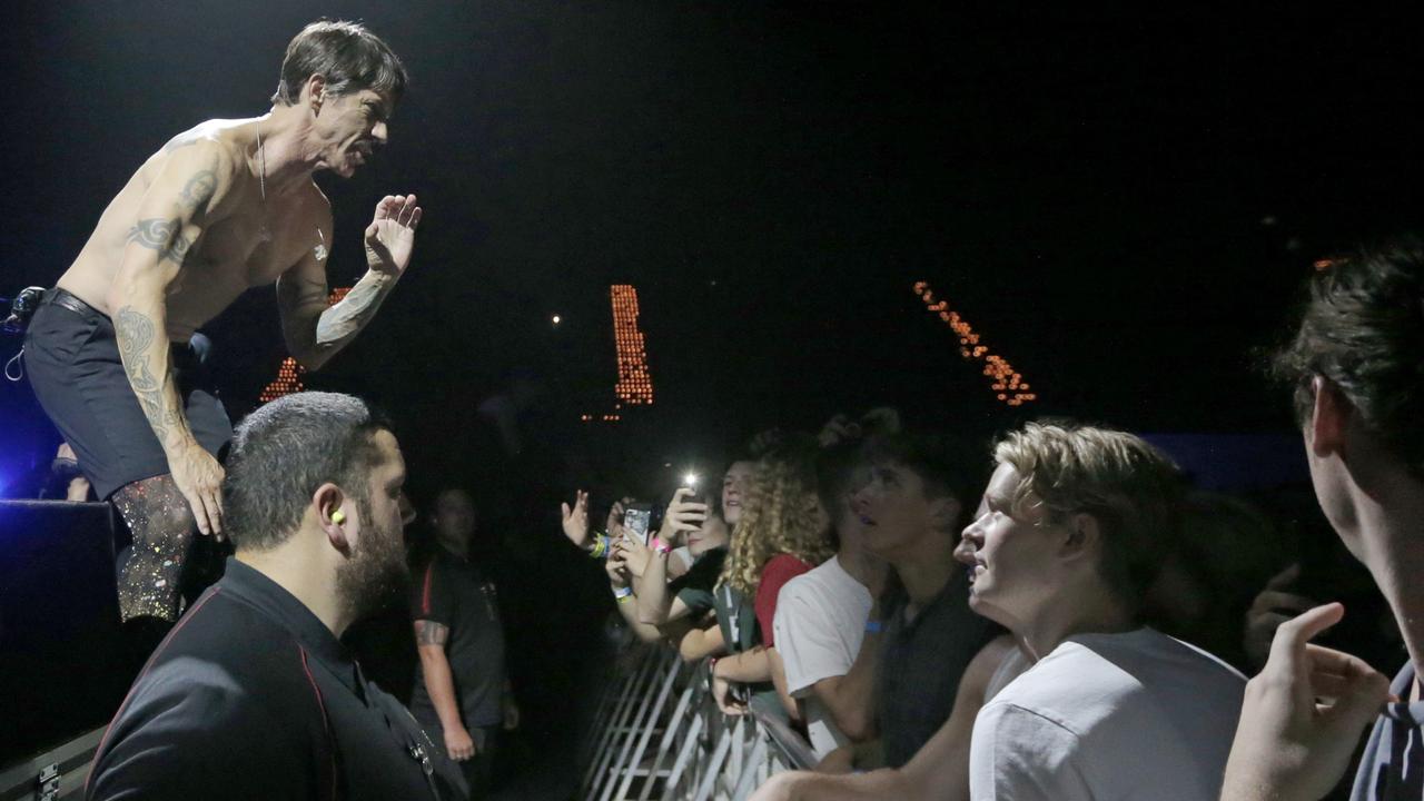 Red Hot Chili Peppers front man Anthony Kiedis asks audience members at Hobart’s Derwent Entertainment Centre to spread a message through the crowd that the band was experiencing technical issues on stage. Picture: PATRICK GEE