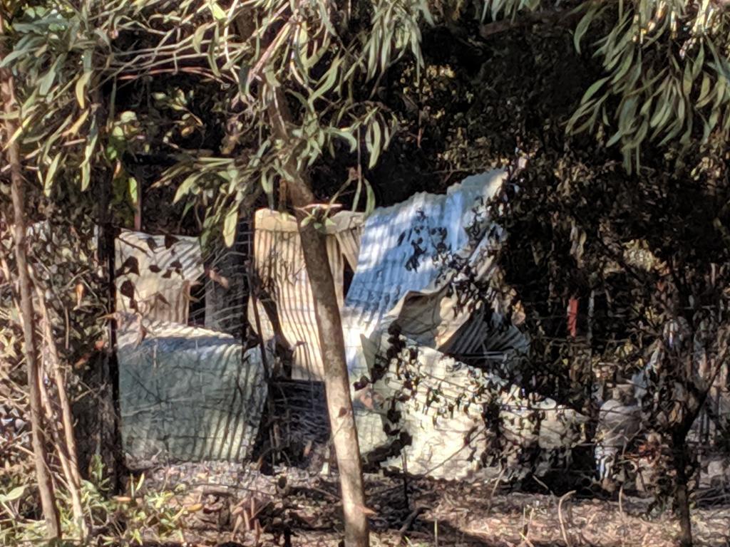 Debris seen from the street following the devastating bushfire. Picture: Luke Mortimer.