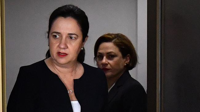 Queensland Premier Annastacia Palaszczuk (left), pictured after meeting energy retailers at Parliament House in Brisbane this week, has pledged to pass on savings to consumers. Picture: AAP/Darren England